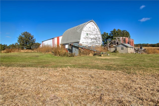 view of yard with a barn and an outdoor structure