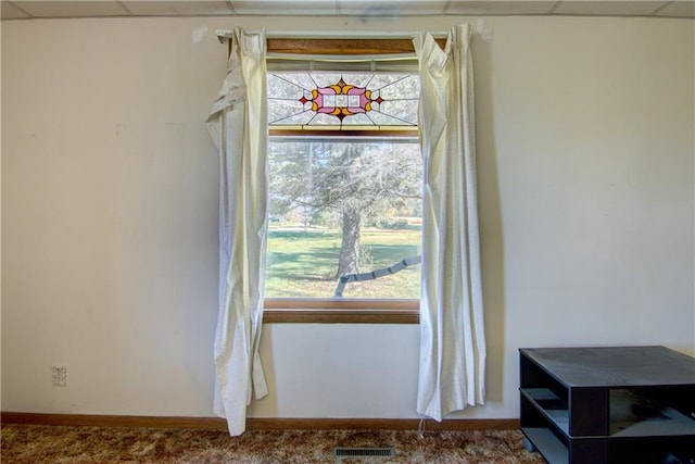 details featuring carpet flooring, visible vents, and baseboards