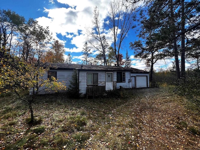 single story home with a garage