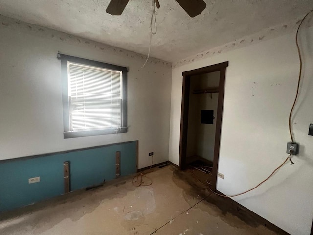 unfurnished room with ceiling fan