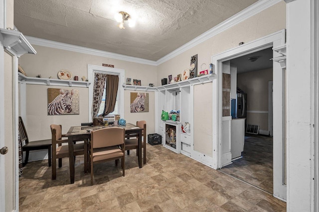 dining room with crown molding and a textured ceiling