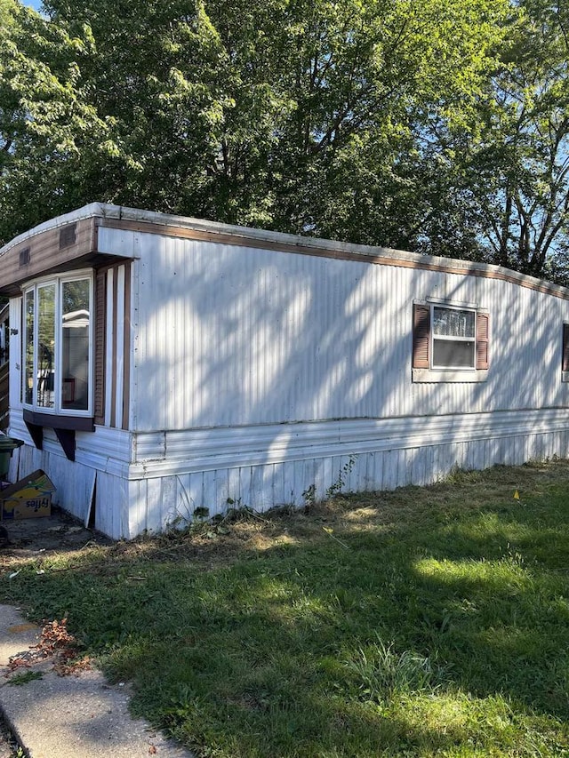 view of property exterior featuring a yard