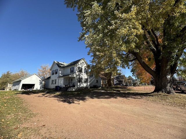 view of property exterior with a garage