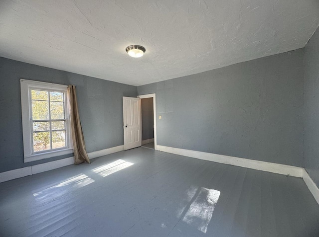 spare room featuring hardwood / wood-style flooring