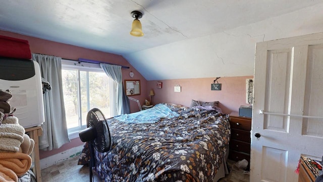 bedroom featuring lofted ceiling