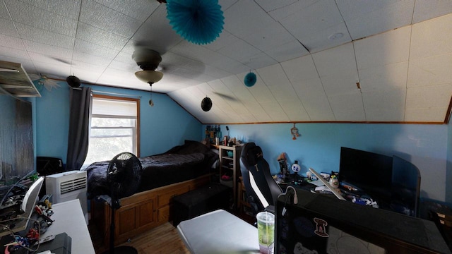 bedroom featuring vaulted ceiling, hardwood / wood-style flooring, and ceiling fan