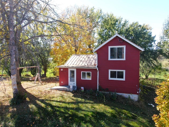 view of outdoor structure with a lawn