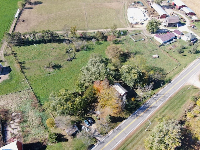 birds eye view of property with a rural view