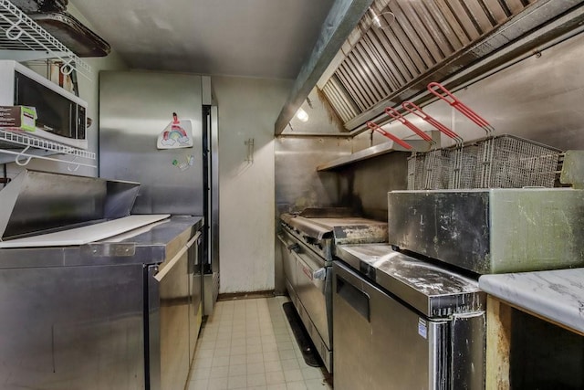 kitchen with stainless steel appliances and range hood