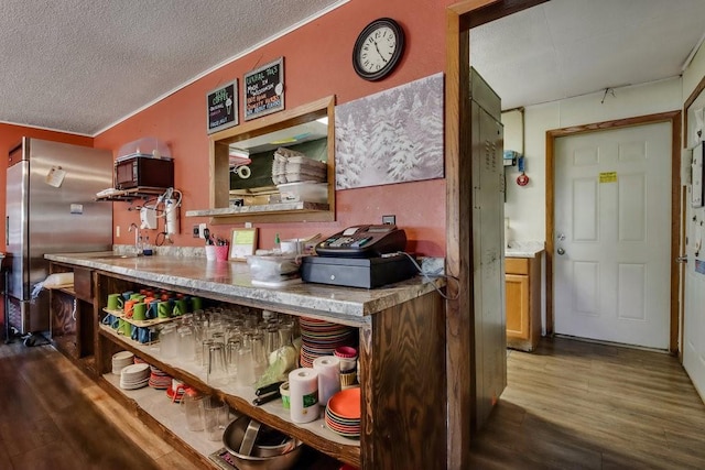 kitchen featuring high quality fridge, a textured ceiling, sink, and dark hardwood / wood-style floors