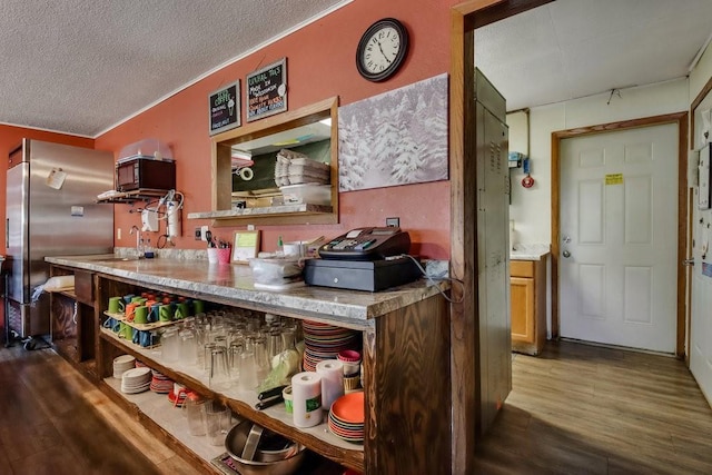 26314 276th St, Holcombe, WI 54745 - kitchen featuring a textured ceiling, open shelves, a sink, wood finished floors, and stainless steel fridge