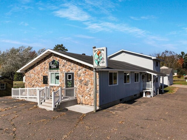 26314 276th St, Holcombe, WI 54745 - view of front of home with stone siding