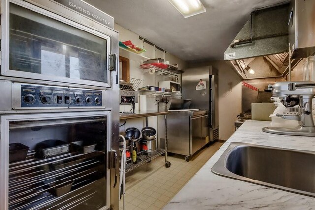 26314 276th St, Holcombe, WI 54745 - kitchen with light floors and light countertops