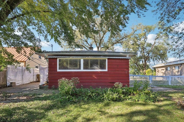 view of home's exterior with a lawn