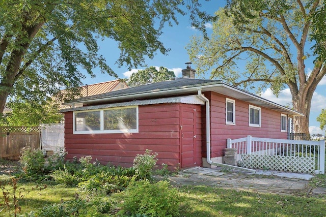 view of side of home featuring a deck