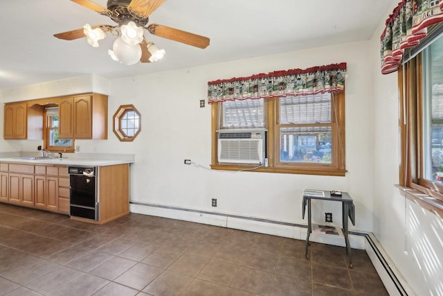 kitchen featuring dark tile patterned floors, dishwasher, sink, a baseboard radiator, and ceiling fan