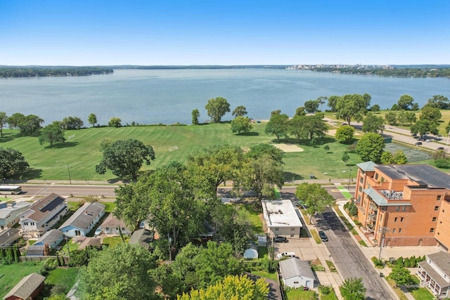 birds eye view of property with a water view