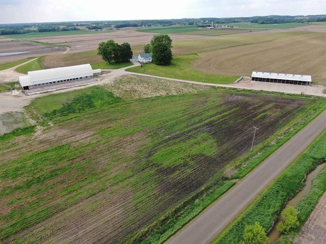 birds eye view of property with a rural view