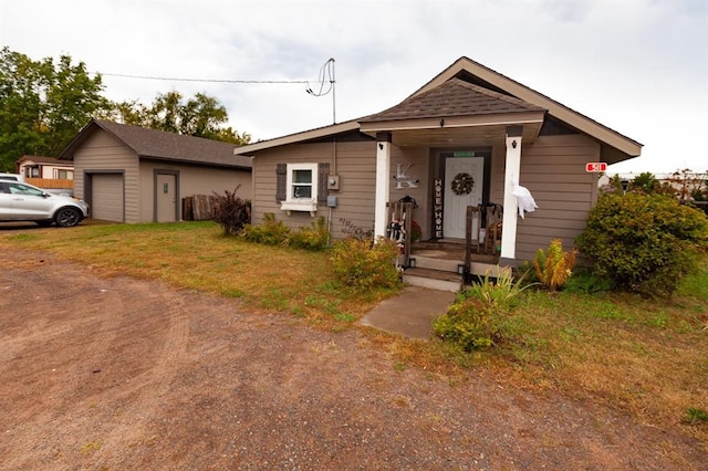 view of front of home featuring a front yard and a garage