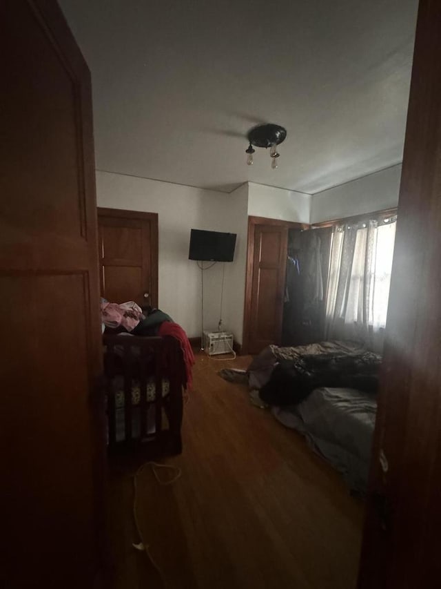 bedroom featuring wood finished floors