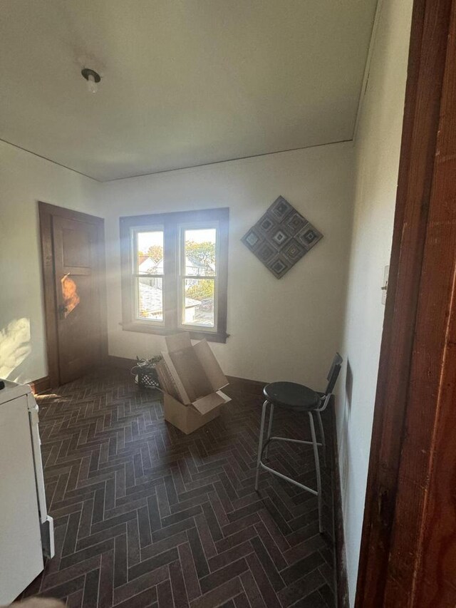 spare room with brick floor