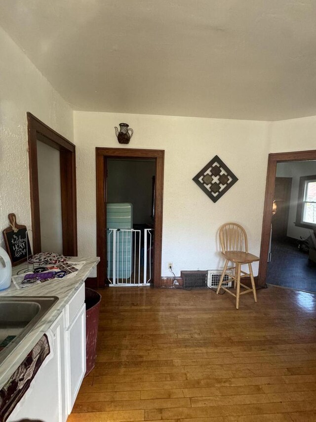 interior space featuring a sink and light wood-style flooring