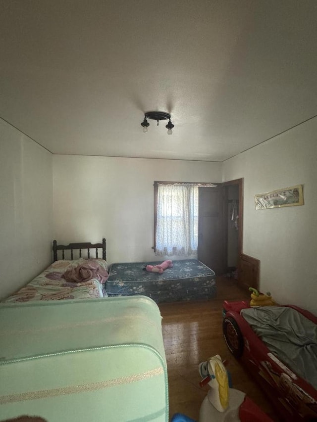 bedroom featuring dark hardwood / wood-style floors