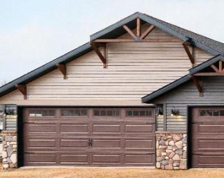 garage featuring wood walls