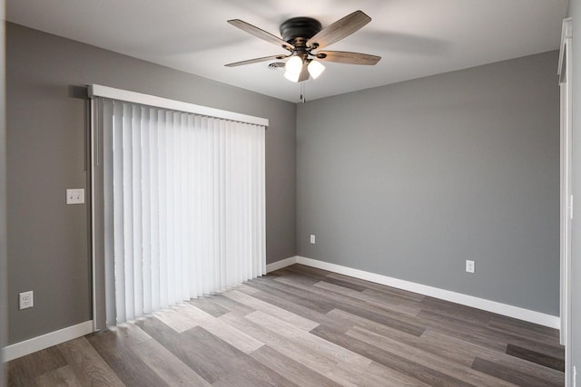 unfurnished room with ceiling fan and light hardwood / wood-style flooring