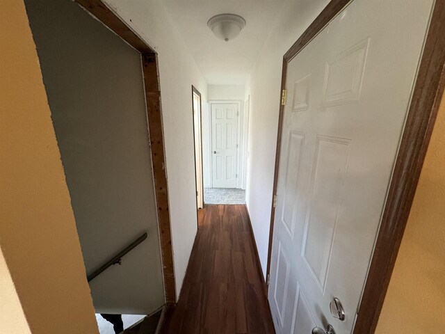 corridor featuring dark hardwood / wood-style floors