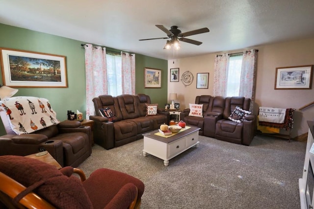 carpeted living room featuring ceiling fan