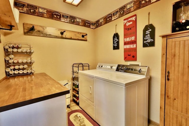 clothes washing area featuring separate washer and dryer