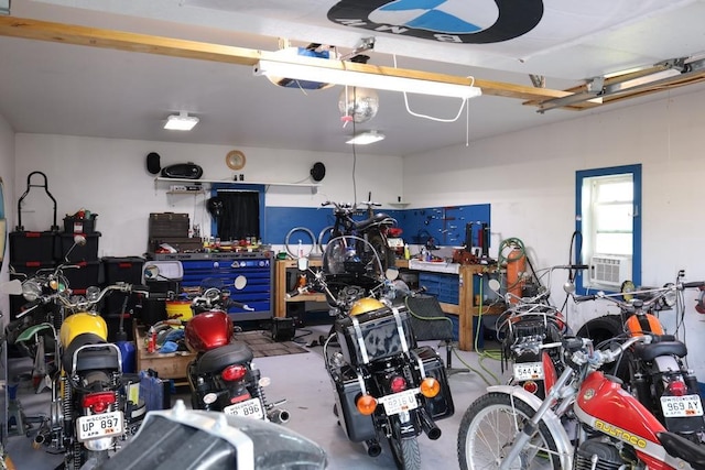 garage featuring cooling unit and a workshop area