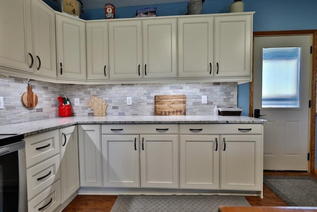 kitchen featuring white cabinetry, stainless steel range, dark wood-type flooring, light stone counters, and decorative backsplash