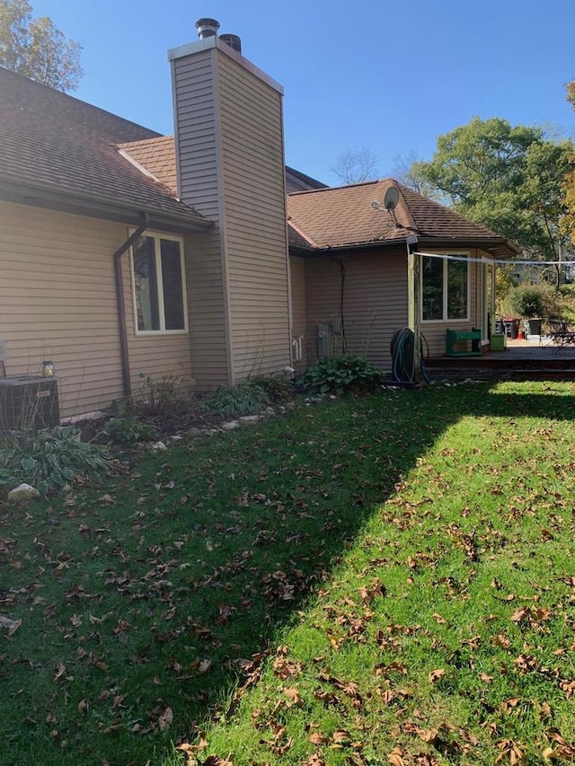 view of home's exterior with a lawn