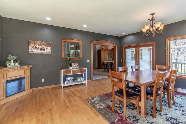 dining room featuring a notable chandelier and wood-type flooring