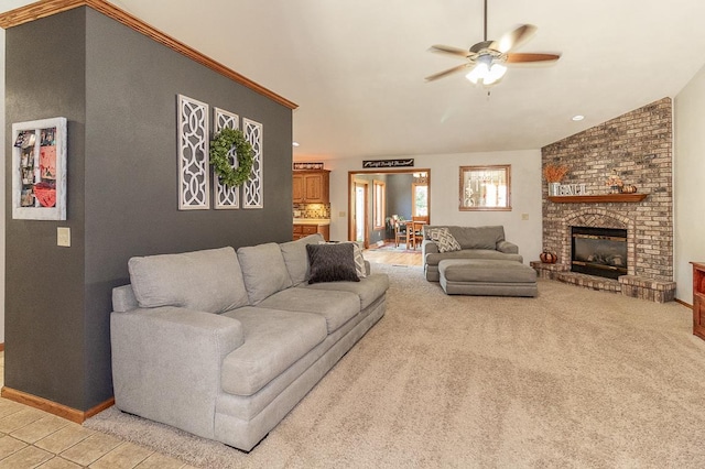 carpeted living room featuring lofted ceiling, a fireplace, and ceiling fan