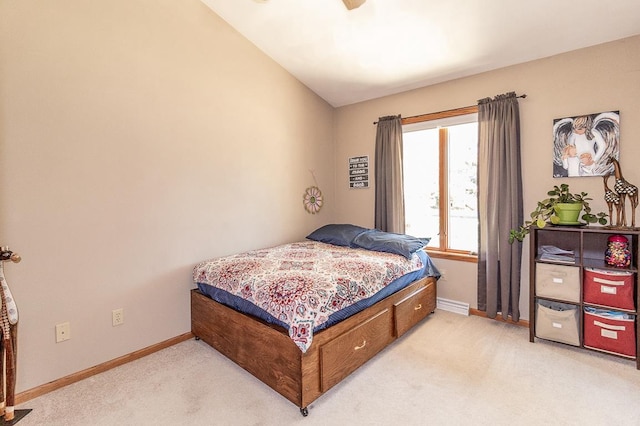 bedroom with light colored carpet and vaulted ceiling