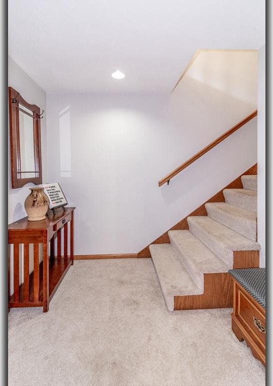 stairs featuring carpet