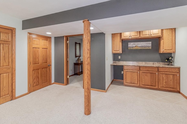 kitchen with light colored carpet