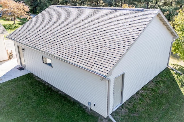 view of side of property with a yard