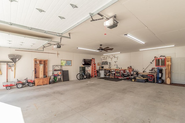 garage featuring ceiling fan and a garage door opener