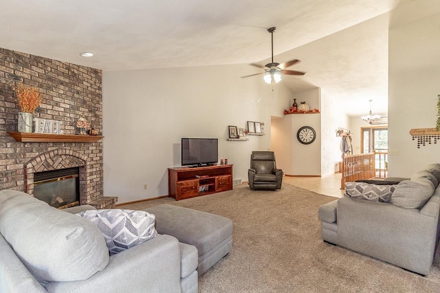 carpeted living room featuring high vaulted ceiling, a fireplace, and ceiling fan