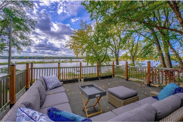 wooden deck featuring a water view and an outdoor hangout area