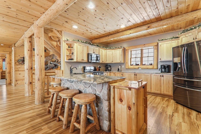 kitchen featuring light brown cabinets, wood ceiling, stainless steel appliances, and a kitchen island