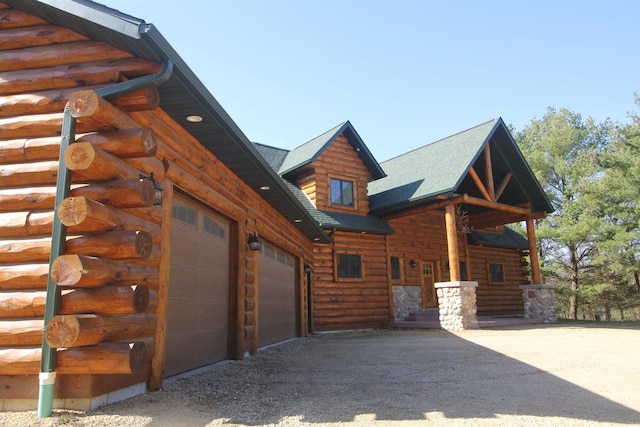 view of side of property with a garage