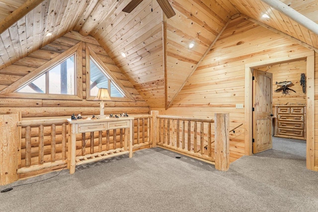 additional living space with wood walls, lofted ceiling, carpet flooring, and wooden ceiling