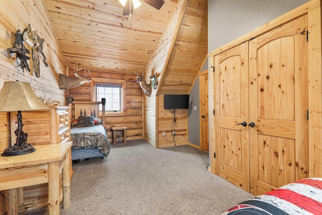 bedroom featuring lofted ceiling, ceiling fan, wooden ceiling, carpet floors, and log walls