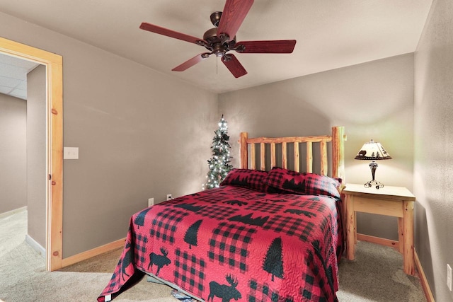 bedroom featuring light carpet and ceiling fan