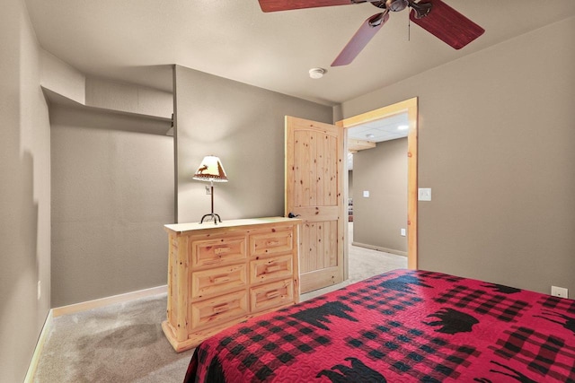 bedroom with light carpet and ceiling fan